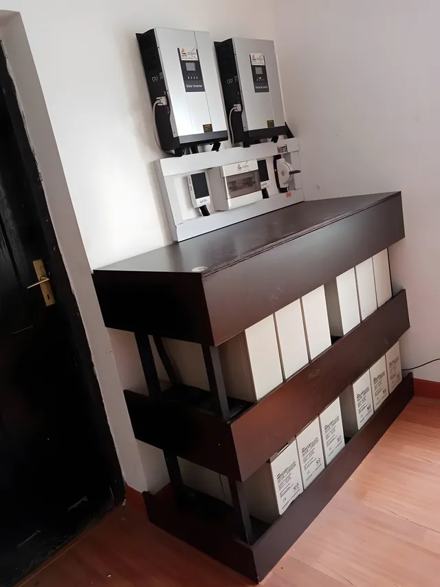 Inverter and batteries in a wooden cabinet