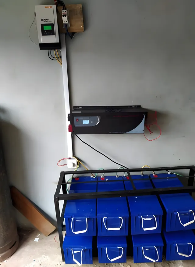 Inverter above a blue battery bank