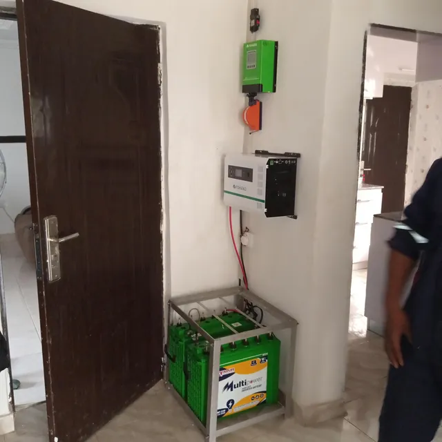 Inverter and green batteries in a hallway
